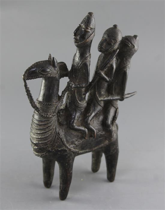 A Lake Chad probably Bornu People bronze group of a camel with three riders, 31cm